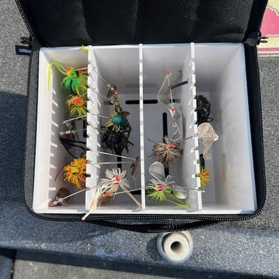 Lakewood Spinnerbait Deposit Box Mini. Perfect smaller storage for your spinnerbaits, buzzbaits, and more. Designed to fit in the compartments of your boat. Hanging storage allows spinnerbaits and buzzbaits to hang down without putting any added tension on the bait frame. Mesh Bottom to allow air flow for drying and to keep baits from rusting. Made in the USA.