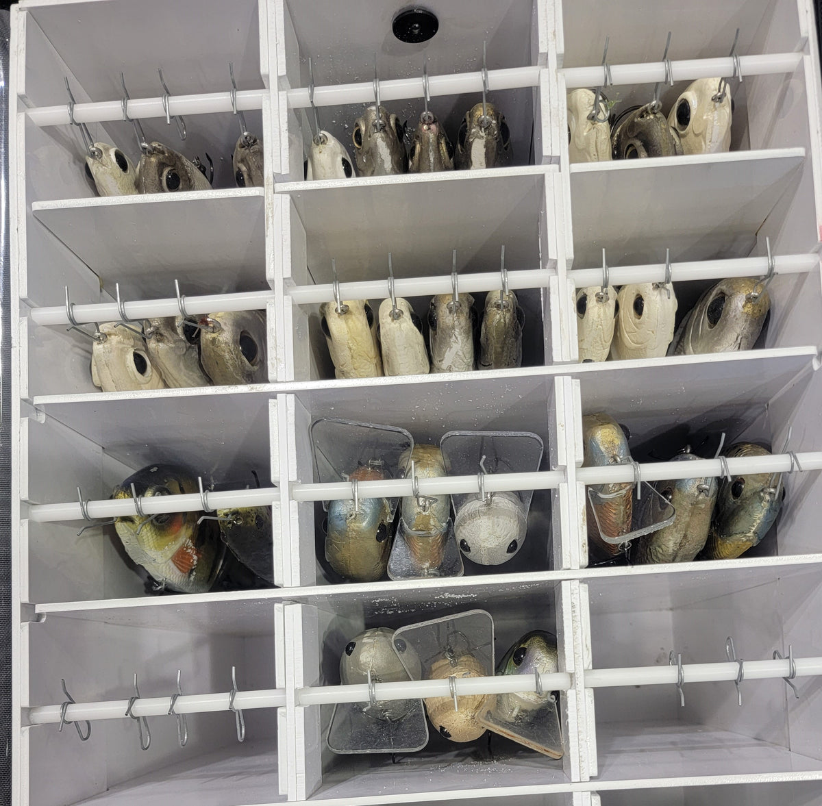 Two sizes available and redesigned interior! The Ultimate Swimbait Tackle Storage! Keep those expensive baits protected! Separate compartments to hang swim baits with individual rods and clips. Front pockets for tools and zippered side pockets for storage.